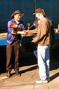 Chris receiving the trophy.